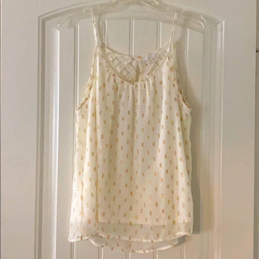 White/cream top with gold sparkles.
